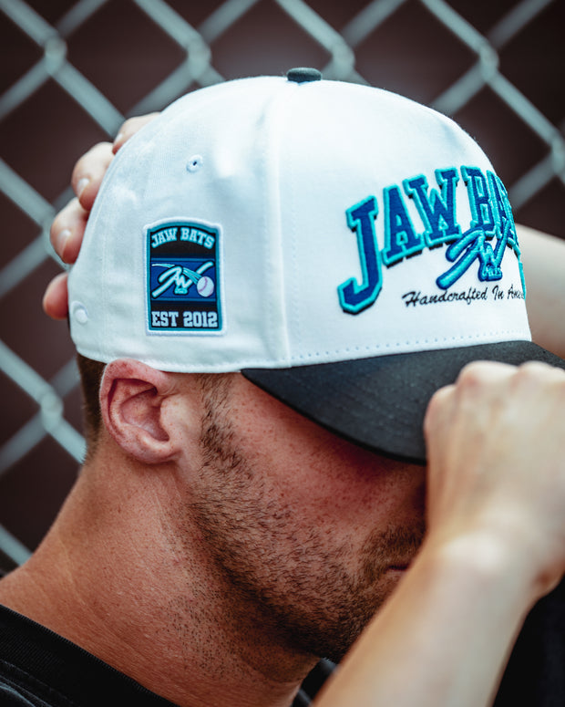 Player putting on the Legacy Jaw Hat